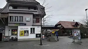 Three-story building with gabled roof