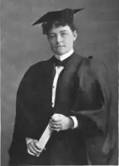 A woman in collegiate garb